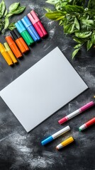 a white marker board lies on a black table, inscriptions and marker stripes are on the marker board