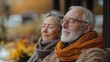 © Wiseman - senior couple meditating together in their living room during cold autumn day