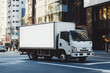 © Suryadil - White Delivery Truck on City Street Photo