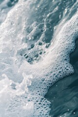 Wall Mural - Close-Up of Ocean Waves with White Foam and Splashing Water Captured in Natural Daylight