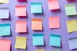 © ItziesDesign - Colorful sticky notes arranged on a purple background for organization and brainstorming ideas.