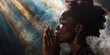 © Vlad - Seeking Help. Black Woman Praying to Jesus Christ for Support in Christian Life