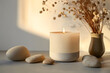 © john - Aroma candle on beige background. Warm aesthetic composition with stones. Cozy home comfort, relaxation and wellness concept. Interior decoration mockup