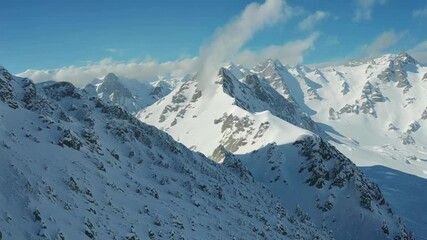 Aufkleber - Snow covered mountains under clear blue sky on sunny day, creating breathtaking winter wonderland scenery