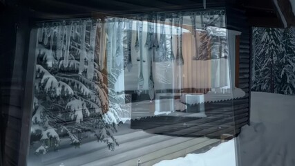 Poster - Cozy wooden cabin nestled in a snow covered forest, with long icicles hanging from the roof, evokes a sense of winter wonderland serenity