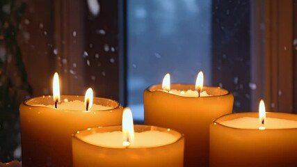 Aufkleber - Five candles softly burning on a window sill, casting a warm glow as snow falls outside, creating a peaceful and romantic setting for winter