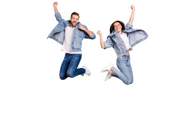 Poster - Photo of overjoyed joyful cute nice couple of spouses jumping flying in air happily while isolated with blue background