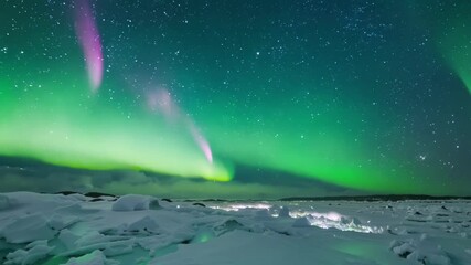 Aufkleber - Graceful green northern lights dance over a snowy landscape, painting the sky with shades of green in this magical winter night scene