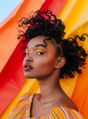 Wall Mural - Black Woman with Curly Hair Posing Against a Colorful Background