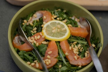 Wall Mural - Fresh salmon salad with pine nuts and lemon