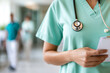 © Pompozzi - Healthcare Professional with Stethoscope in Hospital