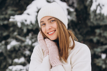 Wall Mural - Portrait of a happy beautiful girl in a winter