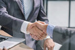 © Katsiaryna - Businessman handshake for teamwork of business merger and acquisition