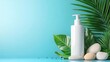 © bteeranan - A minimalist scene featuring a white lotion bottle surrounded by smooth stones and green leaves against a turquoise backdrop.