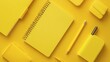 © Puttipong - A flat lay of yellow stationery items, including a notebook and pencil, on a yellow background.