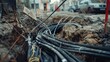 © VK Studio - A close-up of a construction site showing a tangle of black cables buried in the ground.