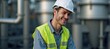 © Pixel Matrix - a man in a hard hat and safety vest smiles at the camera