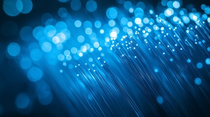 Wall Mural - abstract image of glowing blue fiber optic cables, representing technology, communication, or data t