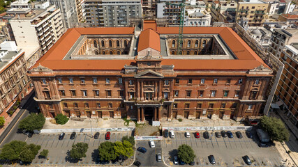 Sticker - Aerial view of the Palazzo degli Uffici, also known as Palazzo Archita, in Taranto, Puglia, Italy. It is one of the most prestigious buildings of the city and overlooks the gardens of Garibaldi square