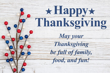 Wall Mural - Happy Thanksgiving message with retro US red, white and blue berries on weathered wood