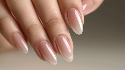 Closeup image of beautiful woman's hands with light pink manicure on the nails. Cream , manicure and beauty treatment. Elegant and graceful arm with slender graceful fingers. Skin care