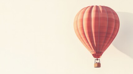 Hot air balloon in traditional design, centered on a blank white backdrop, softly lit.