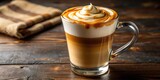 Close-up of a caramel macchiato with creamy foam, selective focus with copy space