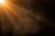 © oscargutzo - orange spotlight on stage or gods rays isolated on black background