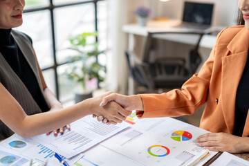 Wall Mural - Businesswomen shaking hands after successful business deal