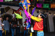 © Marcos - mexican child breaking a pinata at traditional posada celebration for Christmas in Mexico Latin America, hispanic family