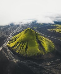 Wall Mural - Aerial view of a green volcanic mountain in Iceland.