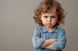 © Anna - Child with crossed arms frowning
