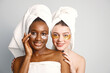 © prostooleh - Two young teenage girls with eye patches on faces have a hair wrapped in towels
