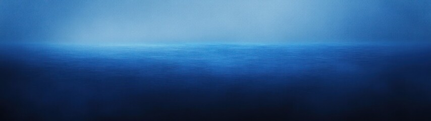 Wall Mural - A serene blue ocean horizon blending into a misty atmosphere.