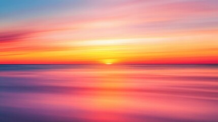 Wall Mural - A vibrant horizon featuring a blurred sunset, with warm orange and pink hues fading into the evening sky for a serene, dynamic effect