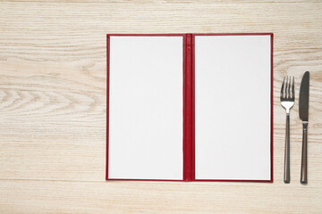 Poster - Hardcover notebook with blank sheets for menu design and cutlery on wooden table, flat lay