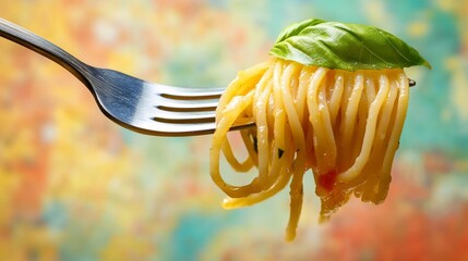 A close-up shot of a fork with delicious pasta and basil leaves, all set against a colorful background.