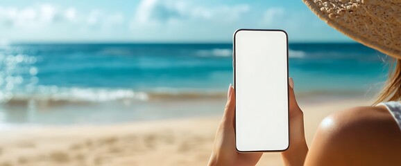 woman holding a smartphone with a blank screen while at the beach.