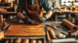 © EmmaStock - Artisanal workshop with leatherworking tools, hand-sewn pieces, and an artisan shaping a new handcrafted product