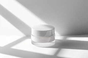Poster - White cosmetic jar is sitting on a white surface casting a shadow