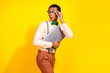 © deagreez - Portrait of attractive classy young man hold laptop look empty space wear shirt bow tie isolated on yellow color background