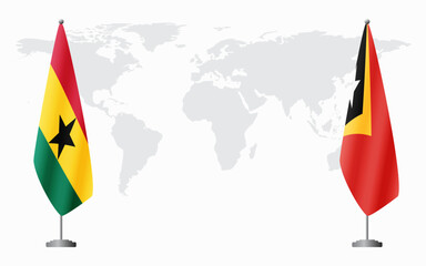 Ghana and East Timor flags for official meeting against background of world map.