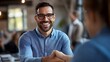 © Keattipoom - Successful Business Deal Handshake - Cheerful Man in Glasses Shaking Hands at Office Meeting