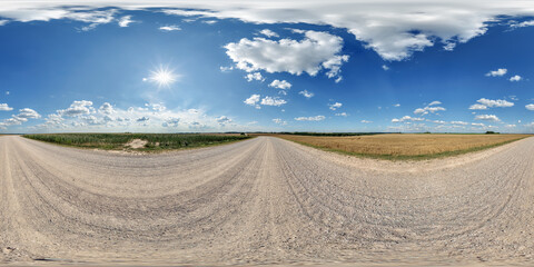 Wall Mural - spherical 360 hdri panorama on side of gravel road with rain storm clouds in dark sky in equirectangular seamless projection, as skydome replacement in drone panoramas, game development
