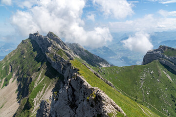 Hiking trail on Mt. Pilatus on a clear summer day in sunshine. Trail leads to Tomlishorn