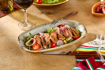 Sticker - Gourmet Steak Salad with Fresh Vegetables and Wine Set on Rustic Wooden Table