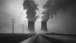 © kept - Black and white image of nuclear power plant towers releasing thick smoke into the sky, with power lines alongside a road.
