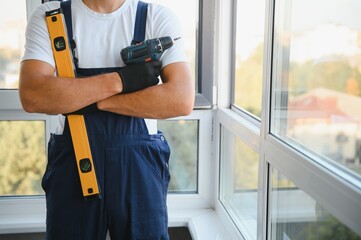 Wall Mural - portrait of a window installation worker