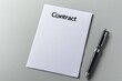 © Sanchai - A single sheet of paper with the word 'Contract' at the top, placed neatly on a plain desk with a pen lying beside it