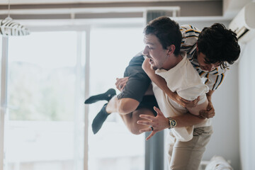 Wall Mural - Two friends having fun indoors, showcasing playful energy and camaraderie in a relaxed home environment. A joyful expression of friendship and leisure time.